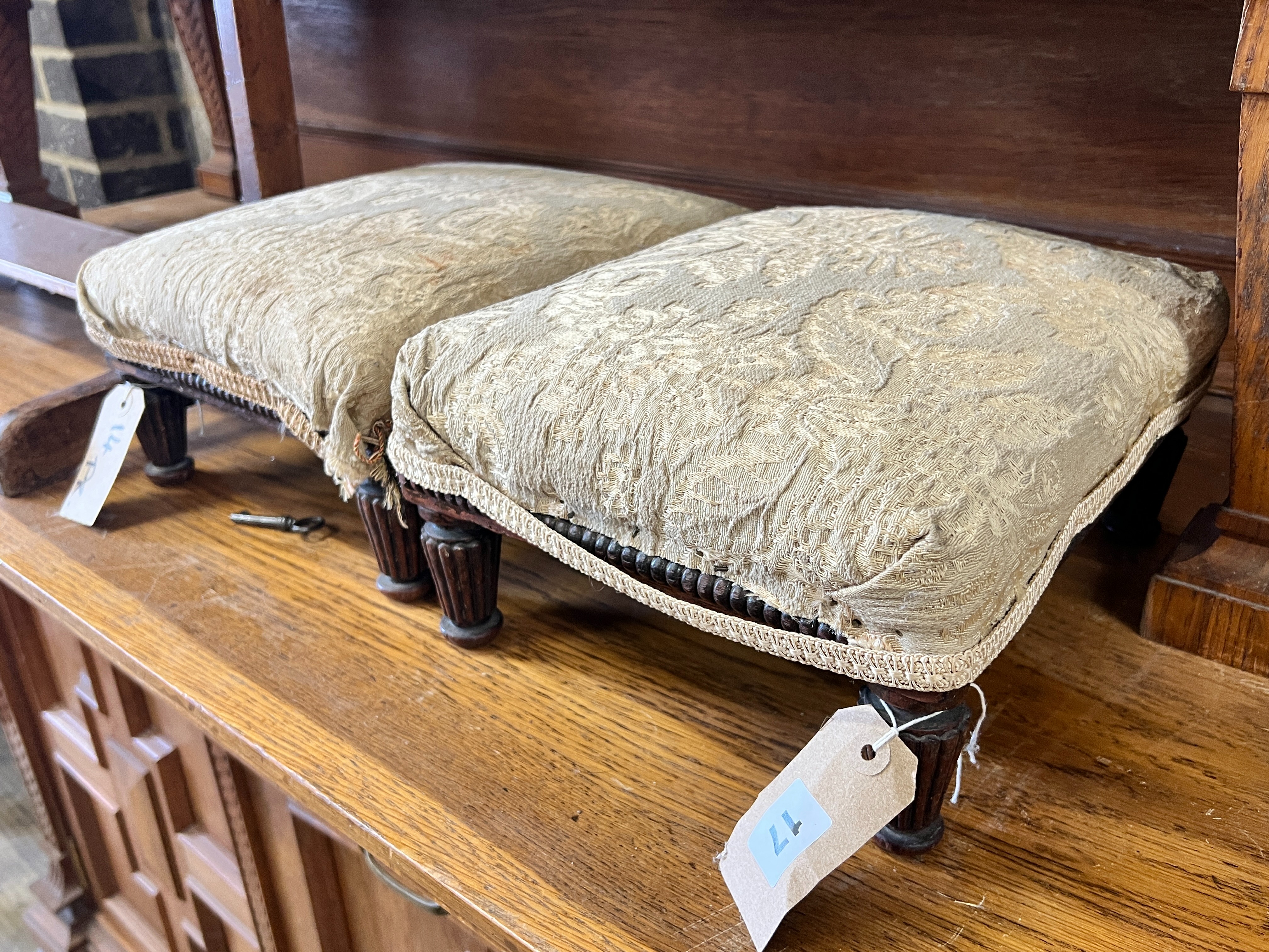 A pair of Victorian mahogany footstools, width 32cm, height 15cm